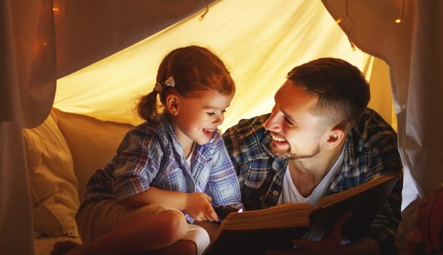Man and child in a tent